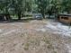 A large lot has sheds and mature trees for privacy at 7608 Franklin Rd, Plant City, FL 33565