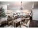 Open-concept area showcases an office, dining room, living area, and kitchen with an abundance of natural light at 7608 Franklin Rd, Plant City, FL 33565