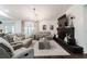 Cozy living room features a modern fireplace, comfortable seating, and plenty of natural light at 7608 Franklin Rd, Plant City, FL 33565