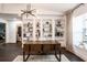 Home office featuring custom built-in shelving, modern lighting, and a dark wood desk at 7608 Franklin Rd, Plant City, FL 33565