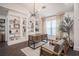Stylish home office featuring custom built-in shelving, modern desk, and an abundance of natural light at 7608 Franklin Rd, Plant City, FL 33565