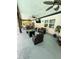 Spacious covered patio with outdoor seating, ceiling fans, and a mounted television, perfect for entertaining at 7608 Franklin Rd, Plant City, FL 33565