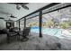 Covered outdoor pool area featuring patio furniture for entertainment at 7608 Franklin Rd, Plant City, FL 33565