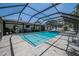 Screened in pool with an outdoor patio and some lounge chairs at 7608 Franklin Rd, Plant City, FL 33565