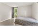 Cozy bedroom featuring a window view, creating a serene space filled with natural light at 1018 Briarwood Ave, Tampa, FL 33613