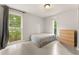 Bright bedroom with natural light and a closet offers comfortable and adaptable living space at 1018 Briarwood Ave, Tampa, FL 33613