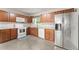 Spacious kitchen with stainless steel refrigerator and ample counter space at 1018 Briarwood Ave, Tampa, FL 33613