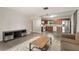 Open living space with neutral paint, and combined kitchen at 1018 Briarwood Ave, Tampa, FL 33613