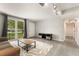 Cozy living room with a large window bringing in natural light at 1018 Briarwood Ave, Tampa, FL 33613
