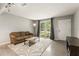 Inviting living room space with a comfortable sofa and large windows at 1018 Briarwood Ave, Tampa, FL 33613