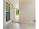 Enclosed patio offers a private outdoor space with access to the fenced backyard at 1018 Briarwood Ave, Tampa, FL 33613