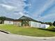 Single-story home with large yard and white fence at 1201 Lavender Jewel Ct, Plant City, FL 33563