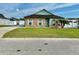 Charming single-story home with brick accents, lovely landscaping, and a well-maintained front yard at 1201 Lavender Jewel Ct, Plant City, FL 33563