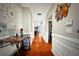 Hallway with wood floors and decorative wall art at 1201 Lavender Jewel Ct, Plant City, FL 33563