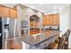Well-equipped kitchen featuring stainless steel appliances and breakfast bar at 1201 Lavender Jewel Ct, Plant City, FL 33563