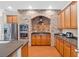 Modern kitchen with stainless steel appliances and stylish brick alcove at 1201 Lavender Jewel Ct, Plant City, FL 33563