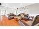 Spacious living room featuring hardwood floors and comfortable seating arrangement at 1201 Lavender Jewel Ct, Plant City, FL 33563