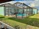 This refreshing pool is set in a screened in enclosure, providing relaxation and privacy at 1201 Lavender Jewel Ct, Plant City, FL 33563