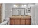 Bathroom featuring double vanity with granite countertops and modern fixtures at 2622 Lantern Hill Ave, Brandon, FL 33511