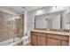 Bathroom features a double sink vanity, tile flooring, and glass enclosed shower at 2622 Lantern Hill Ave, Brandon, FL 33511