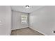 Bedroom with neutral carpet and a window at 2622 Lantern Hill Ave, Brandon, FL 33511