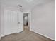 Cozy bedroom featuring neutral carpet and closet at 2622 Lantern Hill Ave, Brandon, FL 33511