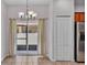 Bright dining area features tile flooring, modern lighting, and sliding door access to the outdoor patio at 2622 Lantern Hill Ave, Brandon, FL 33511