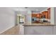 Well-appointed kitchen featuring stainless steel appliances and granite countertops, open to dining area at 2622 Lantern Hill Ave, Brandon, FL 33511