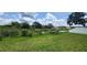 Expansive backyard with a picturesque view of a serene pond at 3188 Nubbin Ridge Ln, Zephyrhills, FL 33540
