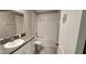 Bathroom featuring a shower/tub combo, toilet, sink and vanity with granite countertops at 3188 Nubbin Ridge Ln, Zephyrhills, FL 33540