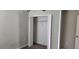 Bedroom closet featuring gray walls, white trim, and a single shelf with hanging rack for optimal storage at 3188 Nubbin Ridge Ln, Zephyrhills, FL 33540