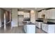Modern kitchen with granite countertops, white cabinets, and stainless steel sink at 3188 Nubbin Ridge Ln, Zephyrhills, FL 33540