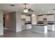 Open-concept living space with tile flooring, ceiling fan and eat-in kitchen at 3188 Nubbin Ridge Ln, Zephyrhills, FL 33540