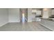 Spacious living area showcasing tile flooring, ample natural light, and an open layout at 3188 Nubbin Ridge Ln, Zephyrhills, FL 33540