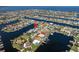 Aerial shot of a waterfront community highlighting canal access and private docks; prime location indicated at 3626 Corsair Ct, New Port Richey, FL 34652