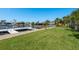 Lush green backyard with a private boat dock offers easy access to the water at 3626 Corsair Ct, New Port Richey, FL 34652