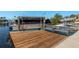 Private dock featuring a boat lift, providing convenient water access and boat storage at 3626 Corsair Ct, New Port Richey, FL 34652
