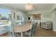Dining room with waterfront views and a decorative chair and shelving at 3626 Corsair Ct, New Port Richey, FL 34652