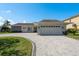 Inviting single-story home boasting a brick driveway, attached garage, and well-maintained lawn at 3626 Corsair Ct, New Port Richey, FL 34652
