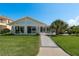 Well-manicured lawn and patio create an inviting outdoor living space with mature landscaping at 3626 Corsair Ct, New Port Richey, FL 34652