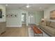 Inviting living area features wood flooring, an open floorplan, and neutral-colored walls at 3626 Corsair Ct, New Port Richey, FL 34652