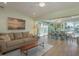 Comfortable living room and dining space with wood floors and ample natural light at 3626 Corsair Ct, New Port Richey, FL 34652