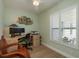 The office space features modern decor, a large window, and natural light at 3626 Corsair Ct, New Port Richey, FL 34652