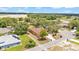 An aerial view shows the home, screened-in patio and the adjacent property at 5370 Boxtree Ct, Dade City, FL 33523