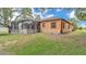 Expansive backyard with a screened-in enclosure, perfect for outdoor entertaining and relaxation at 5370 Boxtree Ct, Dade City, FL 33523