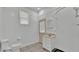 Bathroom features white vanity, and neutral-toned tile flooring at 5370 Boxtree Ct, Dade City, FL 33523