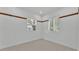 Bedroom with tile flooring, neutral walls, and two windows offering natural light at 5370 Boxtree Ct, Dade City, FL 33523