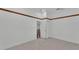 Bedroom with tile flooring, neutral walls, and a walk-in closet at 5370 Boxtree Ct, Dade City, FL 33523