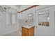 Laundry room features a sink and cabinet, plus a window at 5370 Boxtree Ct, Dade City, FL 33523
