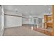 Open floor plan that connects living room to kitchen and includes glass doors for access to the backyard at 5370 Boxtree Ct, Dade City, FL 33523